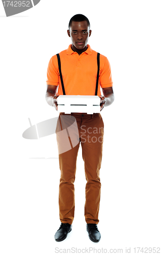 Image of Full length portrait of delivery boy with pizza