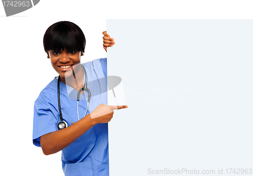 Image of Medical expert pointing towards placard