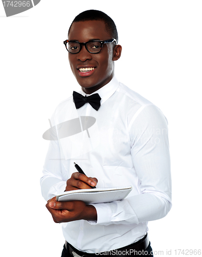 Image of Smart african writing on clipboard