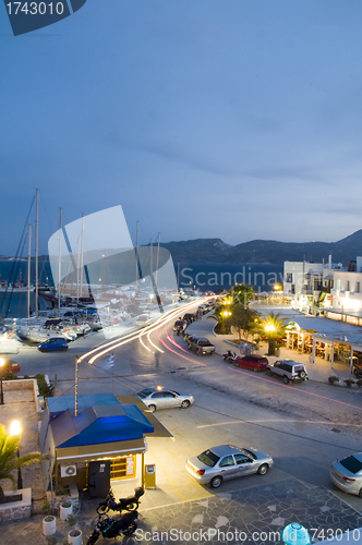 Image of Adamas Milos Cyclades Greek island town at dusk waterfront harbo