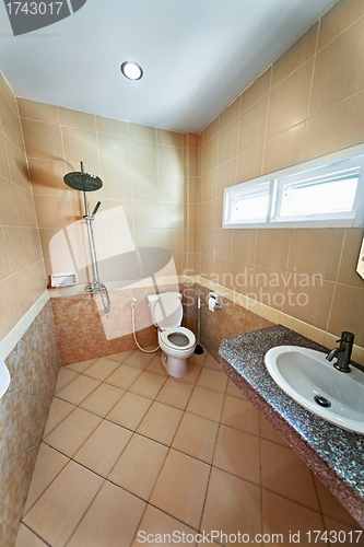 Image of Iinterior of beige bathroom with shower