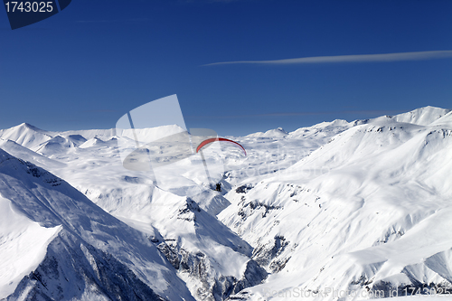 Image of Sky gliding in snowy mountains