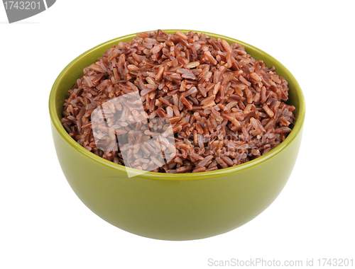 Image of red rice in a green bowl
