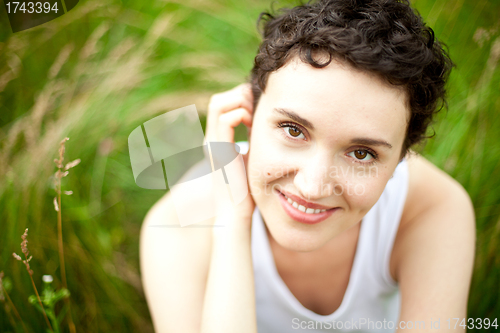 Image of happy cute girl on green field 