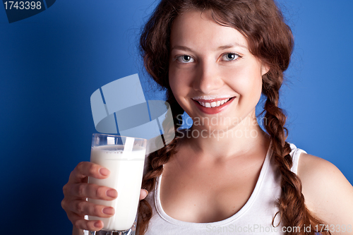 Image of woman enjoying a glass milk 