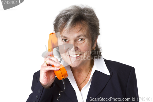 Image of Female senior boss on telephone