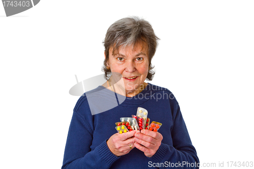 Image of Female senior with pills