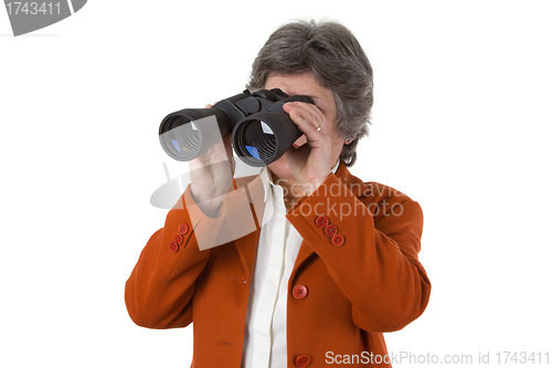 Image of Female senior business woman with binoculars