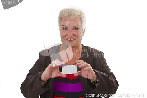 Image of Female senior with business card 