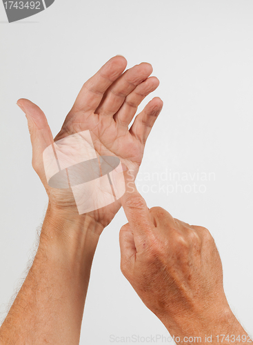 Image of Male hand holding invisible smartphone