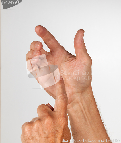 Image of Male hand holding invisible smartphone