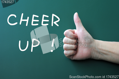 Image of Cheer up written on a blackboard background