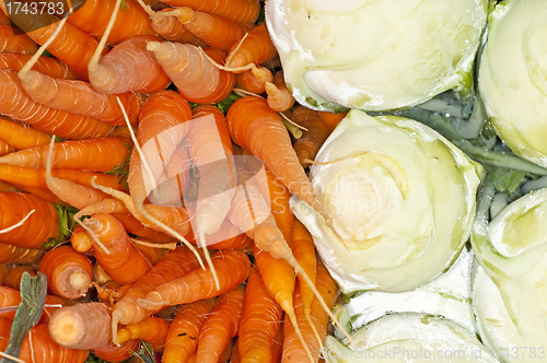 Image of carrot and cabbage turnip at a street sale