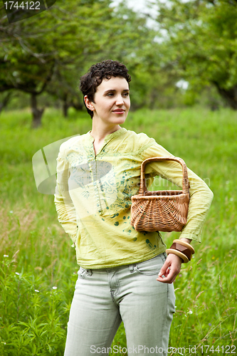 Image of woman with basket in the garden