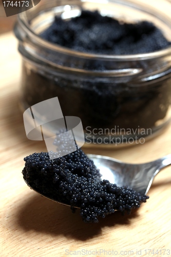 Image of a spoon filled with caviar 