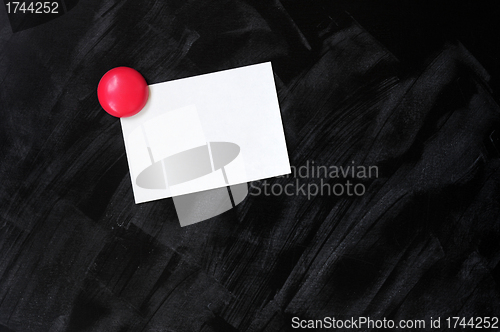 Image of Blank stick note on a blackboard