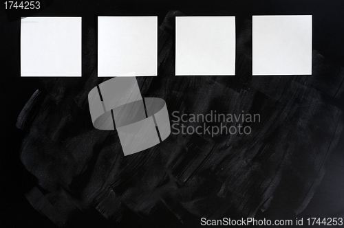 Image of Blank stick note on a blackboard
