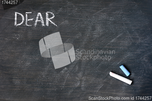 Image of Smudged blackboard background with chalk and the word dear