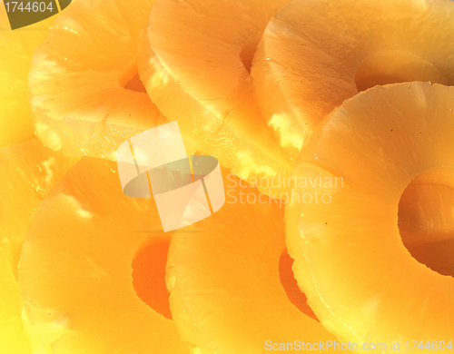 Image of yellow canned pineapple rings, vegetarian food  