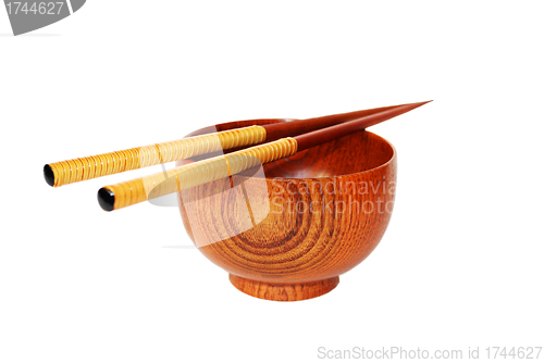 Image of Chopsticks with wooden bowl isolated on white 