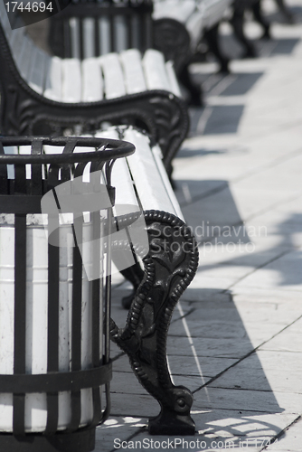 Image of white benches in a park