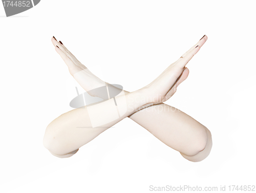 Image of crossed woman's hands , X sign with arms 