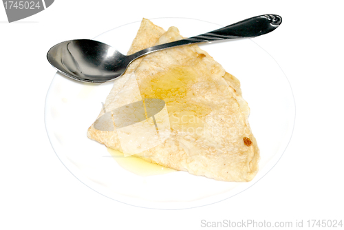 Image of pancake with a honey                