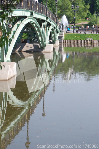 Image of bridge in Moscow city park  at the summer