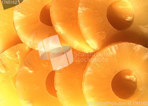 Image of yellow canned pineapple rings, vegetarian food  