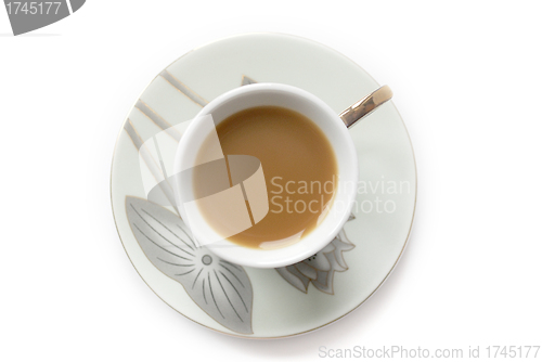 Image of cup of coffee with milk or cream and saucer 