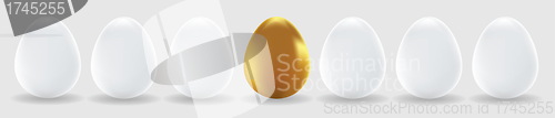 Image of One gold egg and white easter eggs 