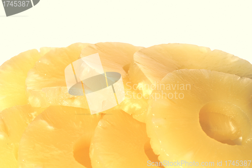 Image of yellow canned pineapple rings, vegetarian food  