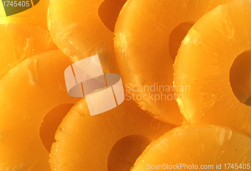 Image of yellow canned pineapple rings, vegetarian food  