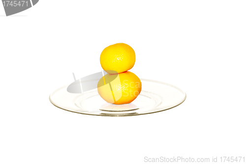 Image of two tangerines on plate isolated on white             