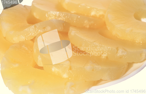 Image of yellow canned pineapple rings, vegetarian food  