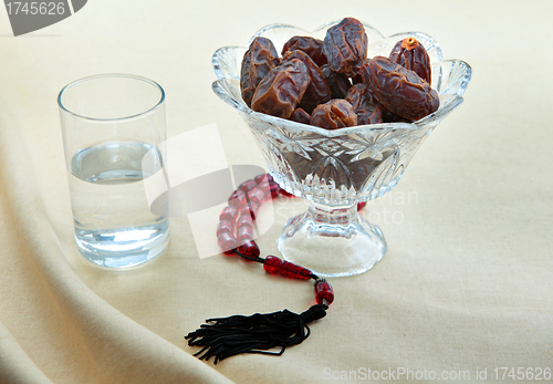 Image of Dates, water and prayer beads