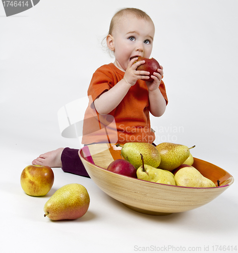 Image of baby with apples and pears