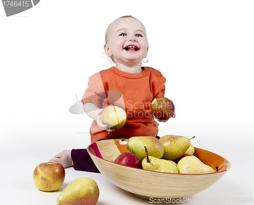 Image of laughing baby with apples