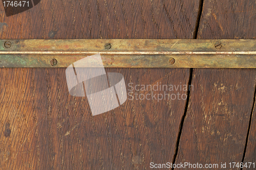 Image of grunge wood and brass
