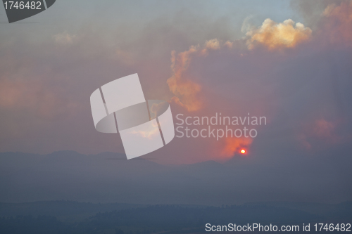 Image of wildfire smole over Rocky Mountains