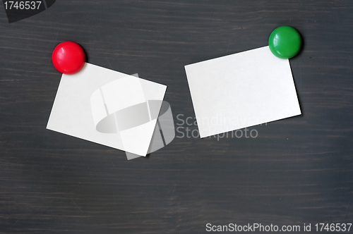 Image of Blank stick note on a blackboard
