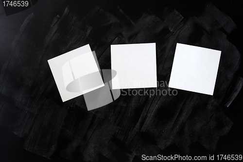 Image of Blank stick note on a blackboard