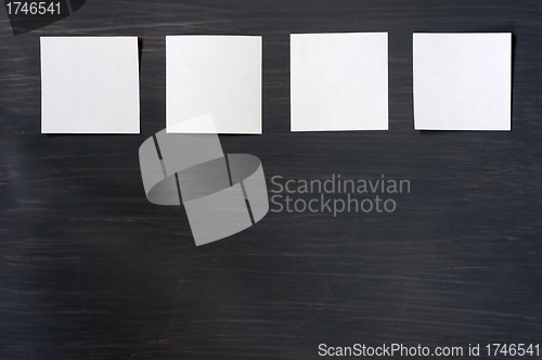 Image of Blank stick note on a blackboard