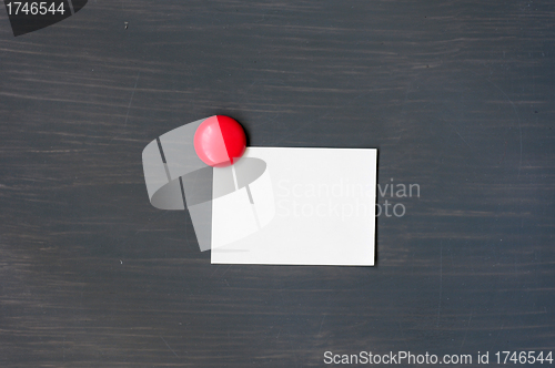 Image of Blank stick note on a blackboard