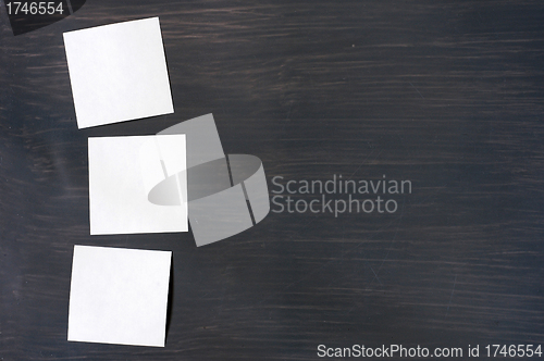Image of Blank stick note on a blackboard