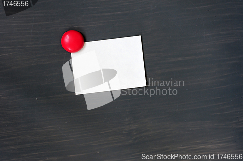 Image of Blank stick note on a blackboard