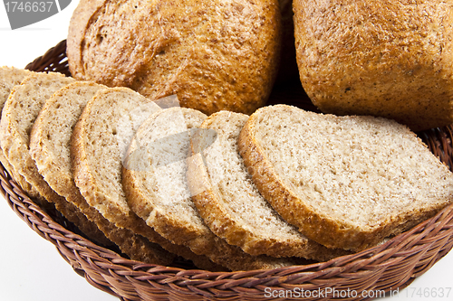 Image of bread with slices in basket close-up