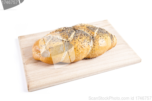 Image of The fresh buns isolated on wooden plate