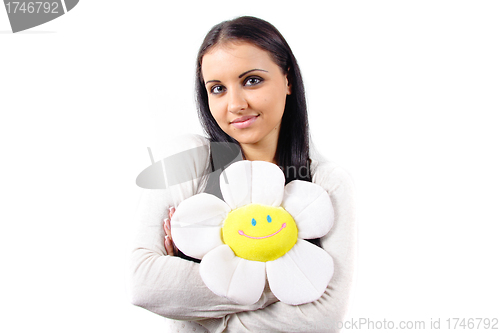 Image of happy woman smiling portrait with chamomile