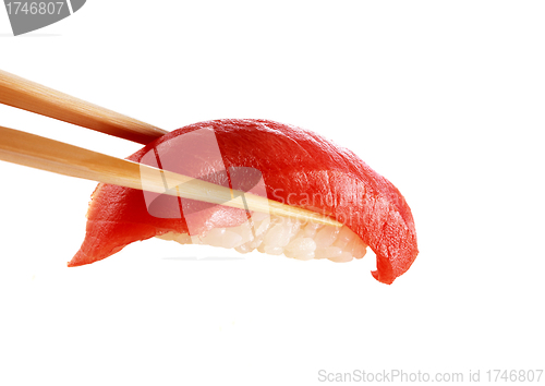 Image of sushi on chopstick